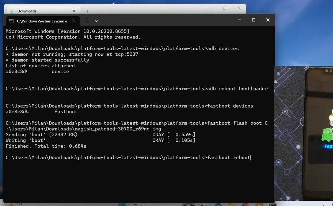 Fastboot command output confirming that the Magisk-patched boot image flashed successfully