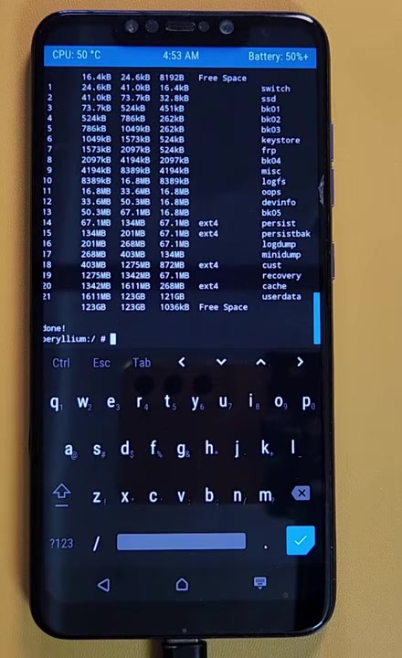 Modified TWRP terminal showing the phone partition table during Windows removal