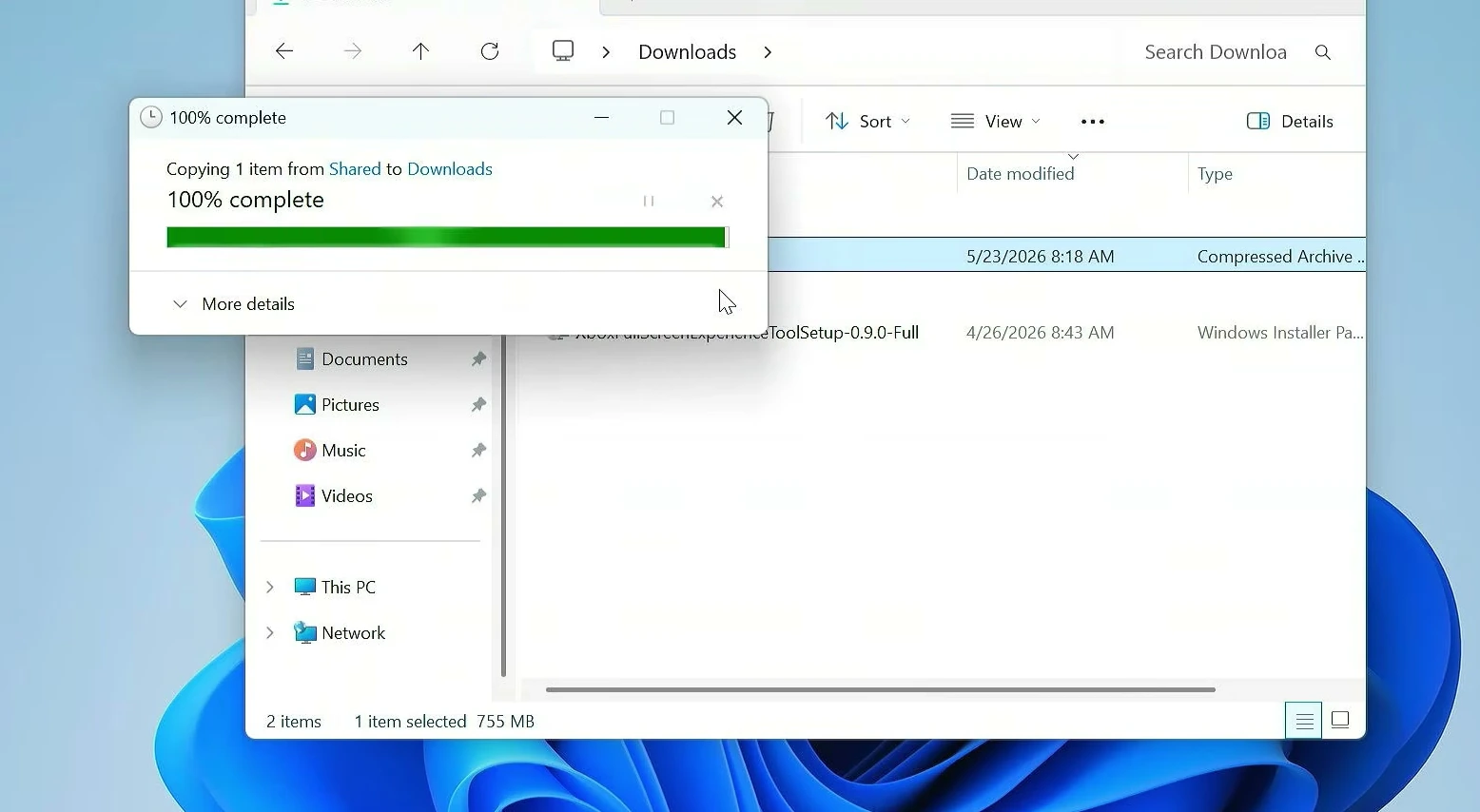 Windows copy progress dialog showing 100% complete while copying one item from the Shared network folder to Downloads.