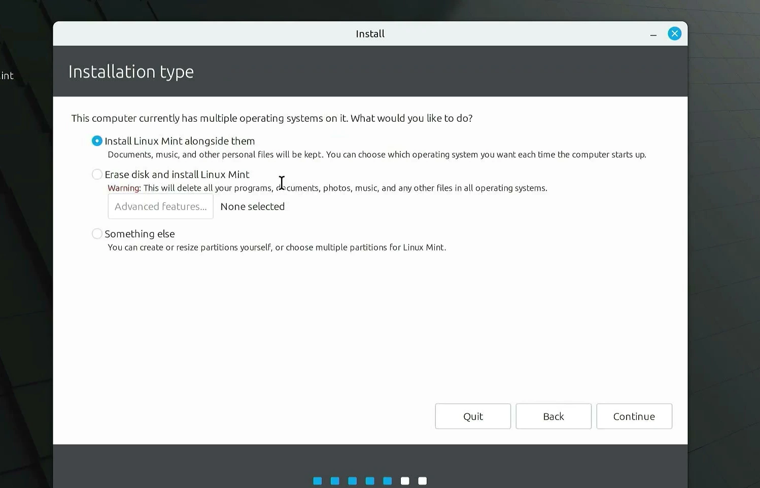 Linux Mint installer showing install alongside, erase disk, and manual partition choices