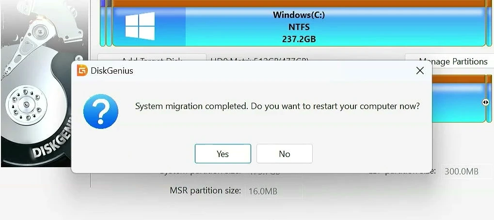 DiskGenius showing that system migration has completed and prompting to restart