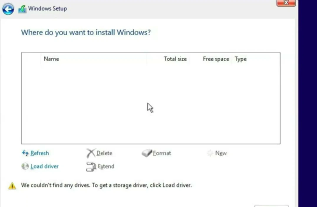 Windows Setup shows an empty drive list with the no drives found error